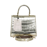 KYRA brand metallic gold croc-embossed handbag with a top handle, detachable shoulder strap, and original brand tags against a white background.