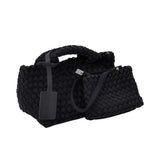 Karisma woven handbag, designed to combine modern texture with practical elegance.