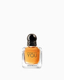 Amber-coloured ARMANI Stronger With You For Him Eau de Toilette in a clear glass bottle with a dark spherical cap.