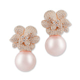 Capture the essence of soft romance with the Lara Heems Rose Pearl Earrings.