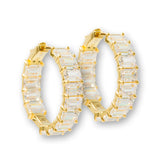 The perfect blend of classic elegance and contemporary luxury with the Lara Heems Carat Gold Hoops.
