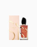 Giorgio Armani Si Parfum 100ml bottle with a dark amber liquid, gold-toned 'S' design, and black cap, next to its light peach
