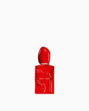 Red rectangular Giorgio Armani Si Passione Eau de Parfum bottle with a glossy finish and a rounded red cap.