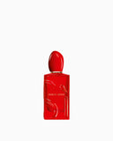 Red rectangular Giorgio Armani Sì Passione Eau de Parfum bottle with a glossy finish, sculpted cap, and embossed 'Sì' logo.