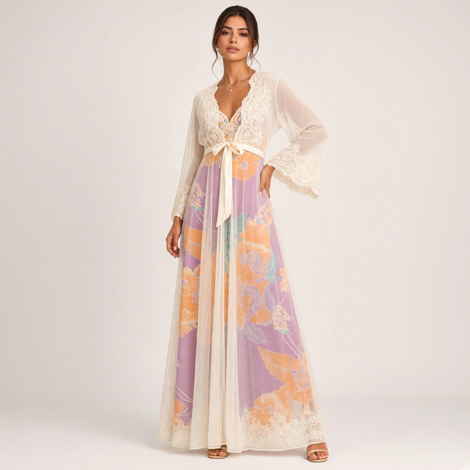 Purple satin maxi dress with orange and teal floral print, paired with a sheer cream robe featuring lace trim and a waist tie