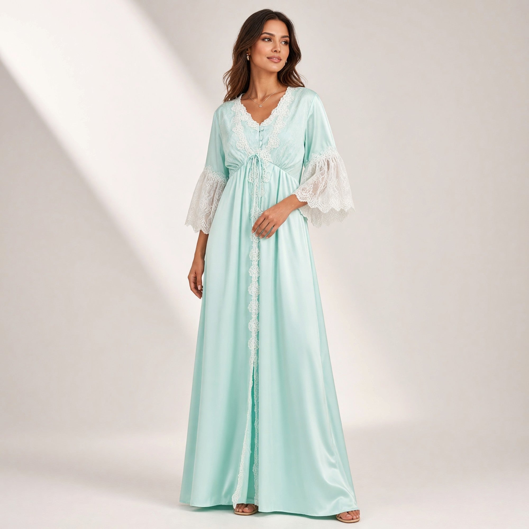 Aqua satin robe with white lace trim on V-neck, front opening, bodice, and bell sleeves. Drawstring empire waist.