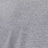 Close-up of light blue and white heathered knit fabric with a textured surface.