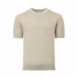 Beige short-sleeved knit top with ribbed crew neck and cuffs, each featuring thin white and black stripes. Ribbed hem.