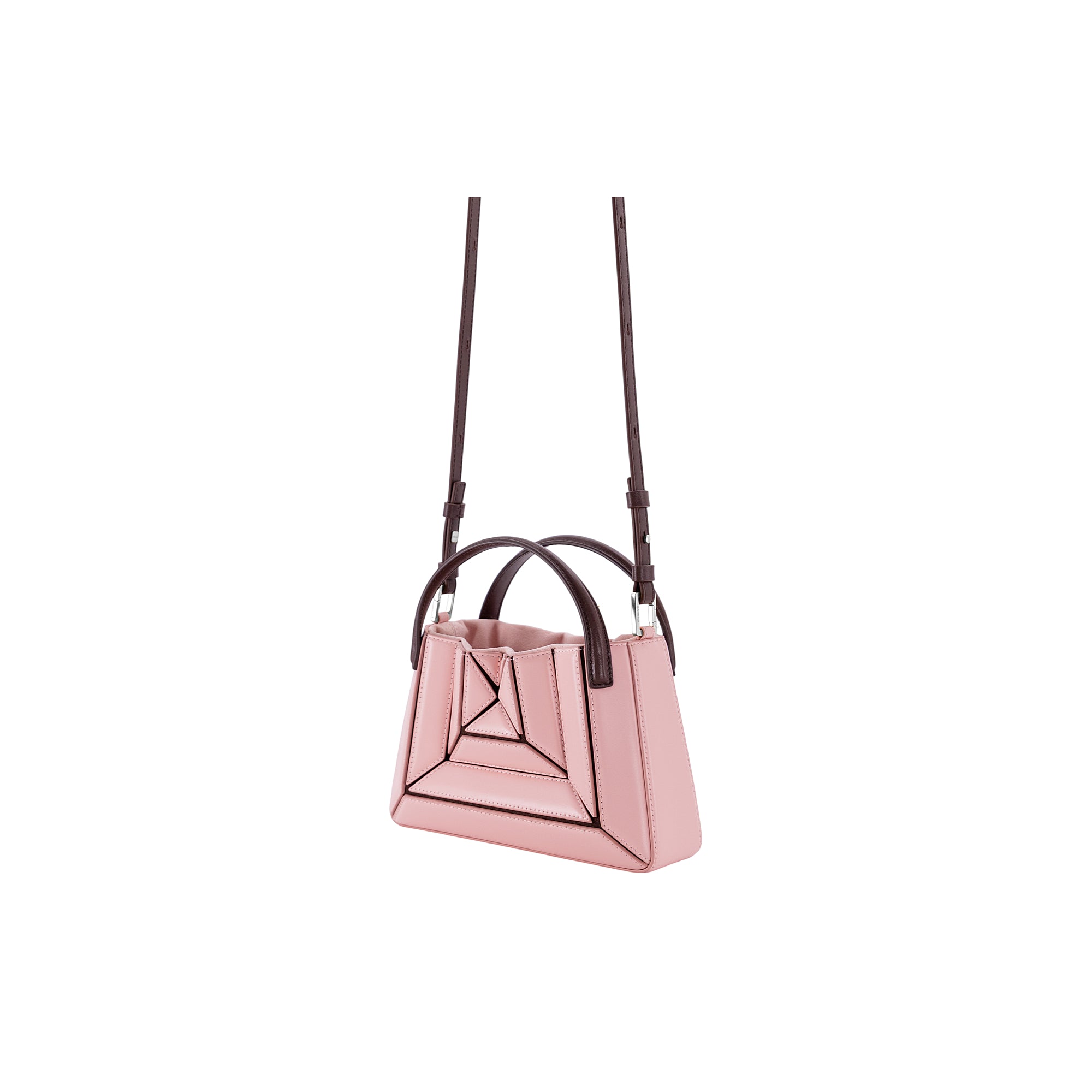 Light pink mini tote bag with geometric front paneling, dark brown top handles, and an adjustable dark brown shoulder strap w