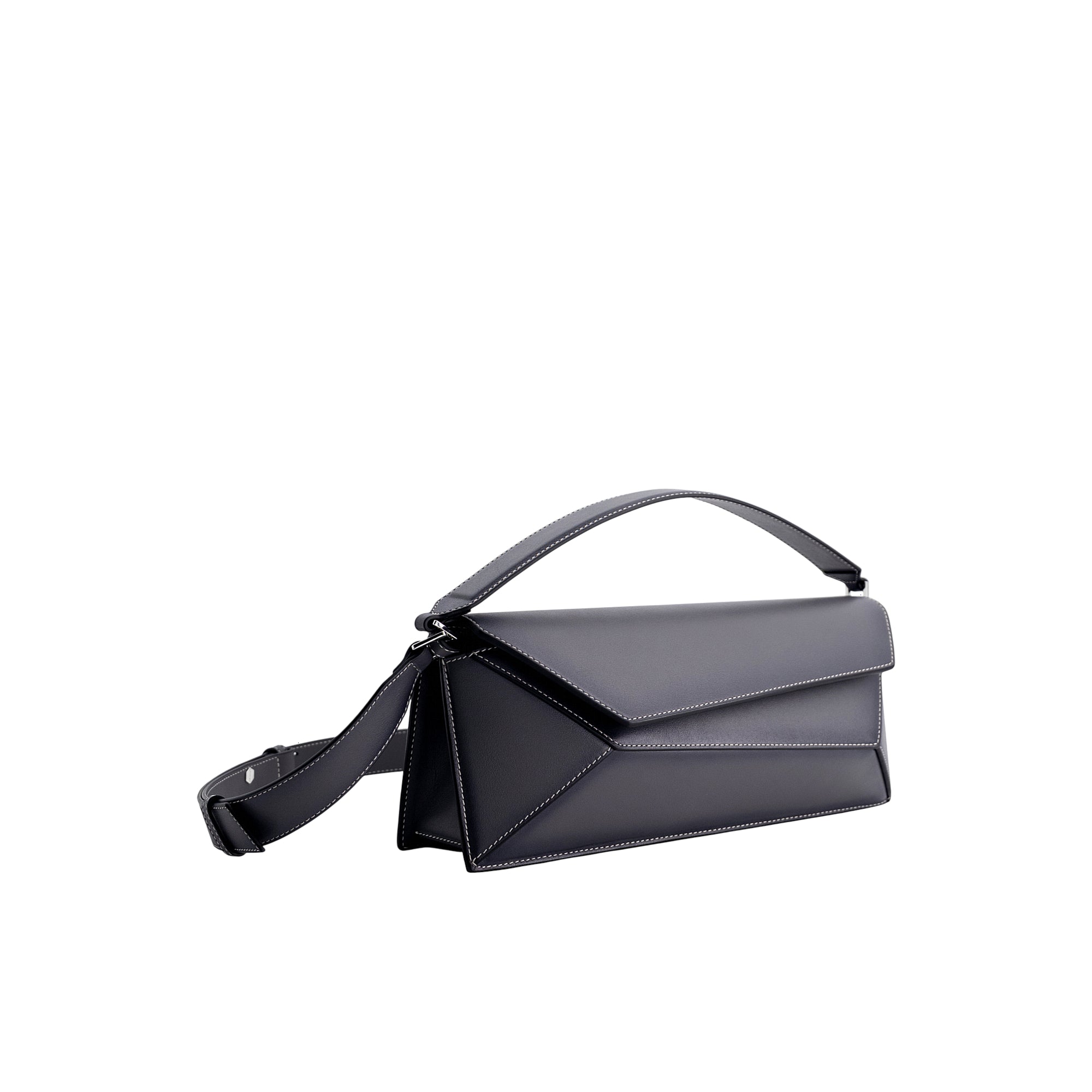 Dark grey baguette bag with angular flap, white contrast stitching, a top handle, and a long adjustable shoulder strap. Silve