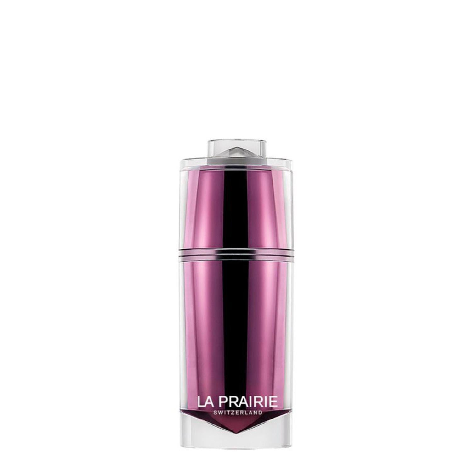 A luxury skincare jar of La Prairie Platinum Rare Haute-Rejuvenation Cream. The jar features a unique multi-faceted, diamond-shaped inner core in a metallic amethyst purple, encased in a clear, high-gloss outer shell. The La Prairie Switzerland logo is printed in silver on the front.