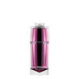 A luxury skincare jar of La Prairie Platinum Rare Haute-Rejuvenation Cream. The jar features a unique multi-faceted, diamond-shaped inner core in a metallic amethyst purple, encased in a clear, high-gloss outer shell. The La Prairie Switzerland logo is printed in silver on the front.