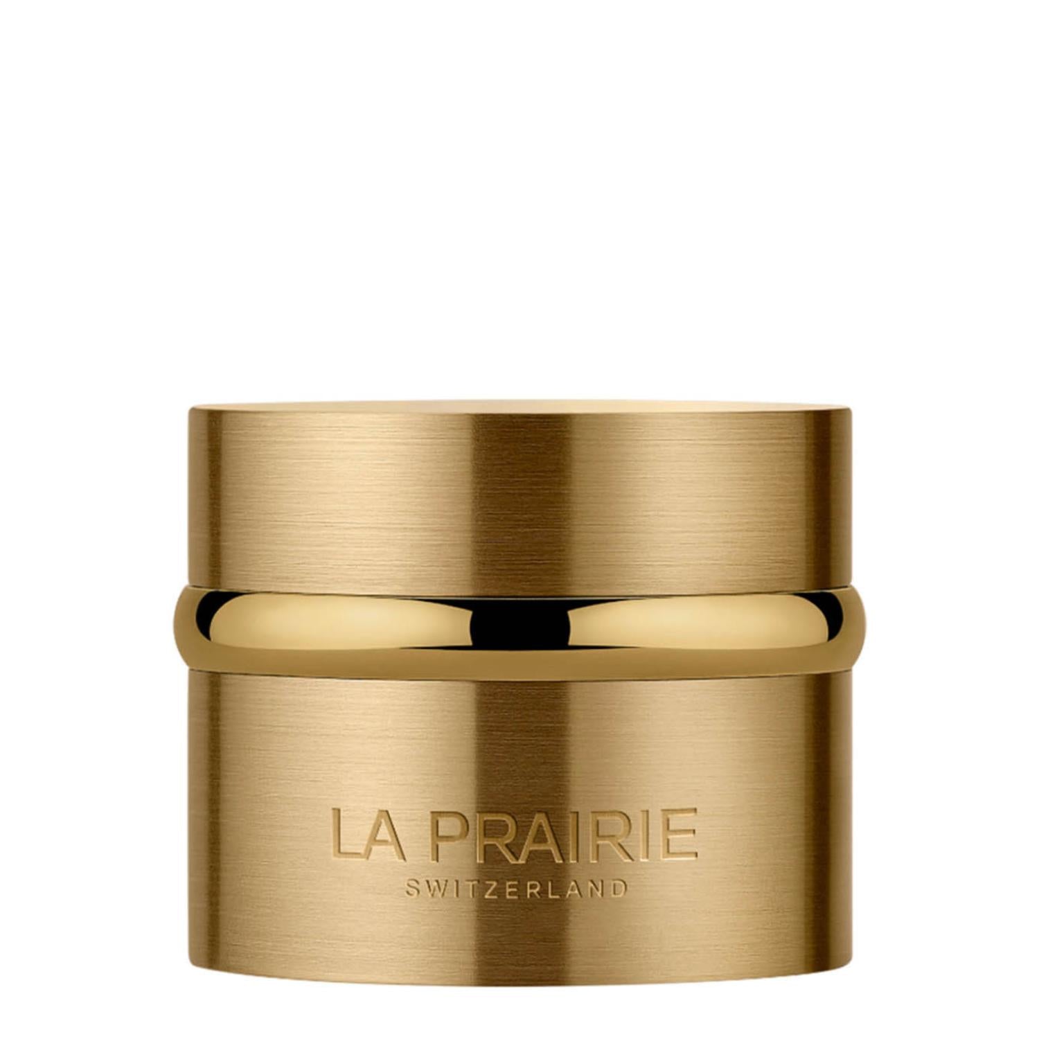 A luxury skincare jar of La Prairie Switzerland Pure Gold Radiance Cream. The container features a brushed gold metallic finish with a polished gold band around the center. The brand name and "Switzerland" are elegantly embossed in silver lettering on the lower half of the jar.