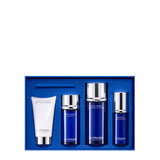 A La Prairie Switzerland skincare discovery set arranged in a vibrant cobalt blue gift box. From left to right, the set includes a white tube of Foam Cleanser, followed by three signature cobalt blue bottles with silver caps: Skin Caviar The Mist, Skin Caviar Essence-in-Lotion, and Skin Caviar Hydro Emulsion.