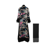 Back view of the LAMAR velvet abaya showing the full-scale botanical floral pattern and floor-length silhouette.