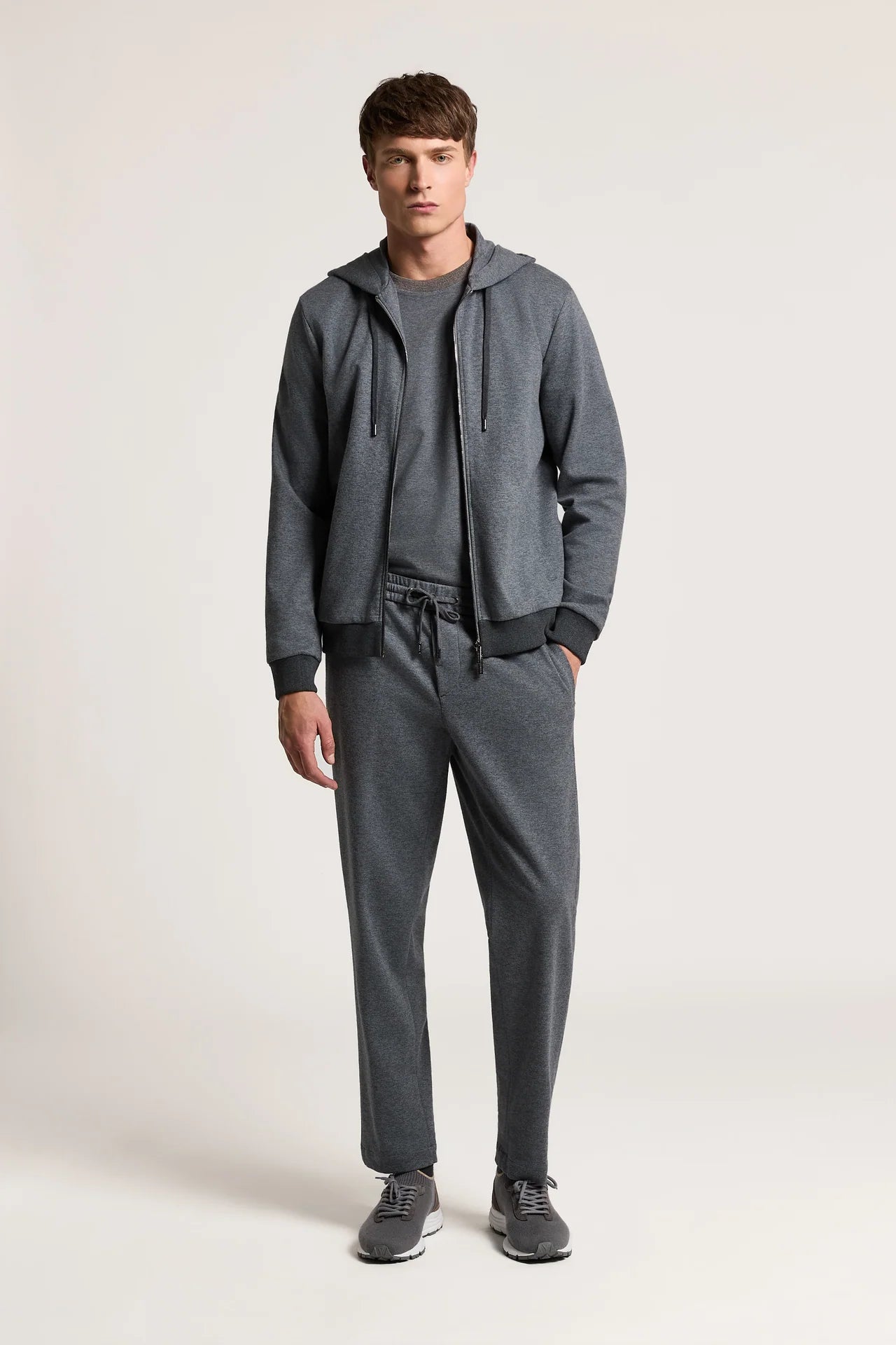 Galaxy blue jersey trousers with an elastic drawstring waist, side pockets, and open leg hems.