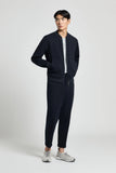 Dark blue cotton jersey bomber-style sweatshirt with a silver-toned front zipper, ribbed collar, cuffs, and hem, and two fron