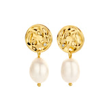 Pair of yellow gold-plated drop earrings with hammered gold discs, each featuring a small clear stone and a dangling off-whit