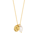 Gold-toned link chain necklace with a hammered gold-toned disc charm featuring a small clear stone, and an irregular white pe