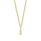 Yellow gold plated necklace with a delicate chain and a pendant featuring three round clear stones in a vertical drop.