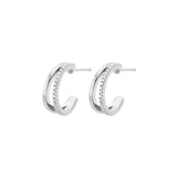 Pair of white-plated double-hoop earrings, with one hoop featuring a row of clear pavé-set stones and a stud fastening.