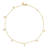 Yellow gold-plated delicate chain necklace with multiple small, textured leaf-shaped charms and an adjustable lobster clasp.