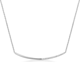 Silver-toned necklace with a delicate chain and a curved bar pendant. One half of the bar is smooth, the other half is set wi