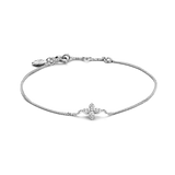 White plated delicate chain bracelet with a central four-petal flower motif made of clear, faceted stones, and a lobster clas