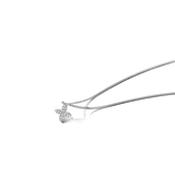 Silver-toned curb chain necklace with a small flower pendant made of four clear, round, faceted stones.