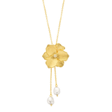 Yellow gold-plated necklace with a textured floral pendant, a small clear stone in the centre, and two dangling chains ending