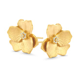Pair of yellow gold-plated jasmine flower stud earrings with clear crystal centres.