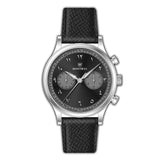 Monteva vintage chronograph watch with a silver-toned case, black dial with white Arabic numerals, and a black textured leath