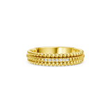 Gold-toned band ring with beaded top and bottom edges, and a central row of small, round, clear sparkling stones.