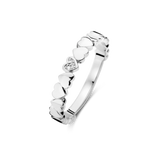White plated ring with a continuous band of polished heart motifs, one heart embellished with small clear stones.