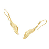 Pair of gold-toned dangle earrings. Each features a small clear stone above an elongated, textured leaf with etched veins.