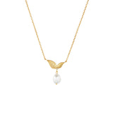 Gold-toned necklace with two textured leaf pendants, a small clear stone, and an irregular white pearl drop.