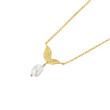 Gold-toned necklace with a textured leaf pendant featuring a small clear stone and a dangling irregular white pearl.