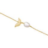 Gold-toned chain bracelet with two textured leaf charms, a small clear stone, and an irregular off-white baroque pearl.
