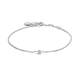 Silver-toned chain bracelet with a single round white diamond in a bezel setting and a lobster clasp.