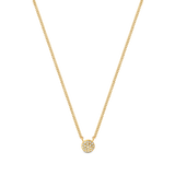 Gold-toned fine curb chain necklace with a small, flat, circular pendant featuring multiple clear stones set closely together
