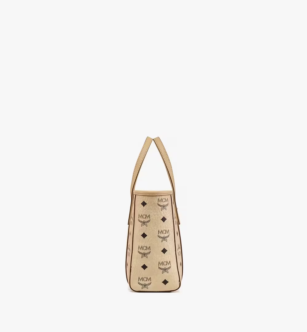 Side profile of the MCM Mini Toni Shopper highlighting its structured silhouette and Nappa leather handles.