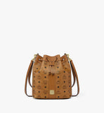 Front view of the MCM Dessau Drawstring Bag in Cognac Visetos showing the leather drawstring and gold-tone logo plate.