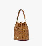 A perspective view highlighting the bucket silhouette and the detachable Nappa leather shoulder strap.