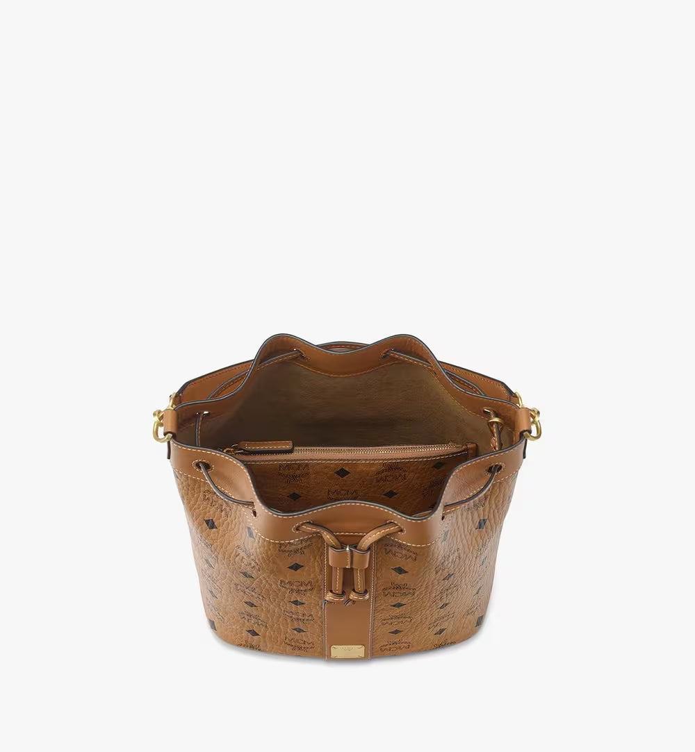 An overhead view showing the wide-opening interior with the detachable monogram pouch nested inside.