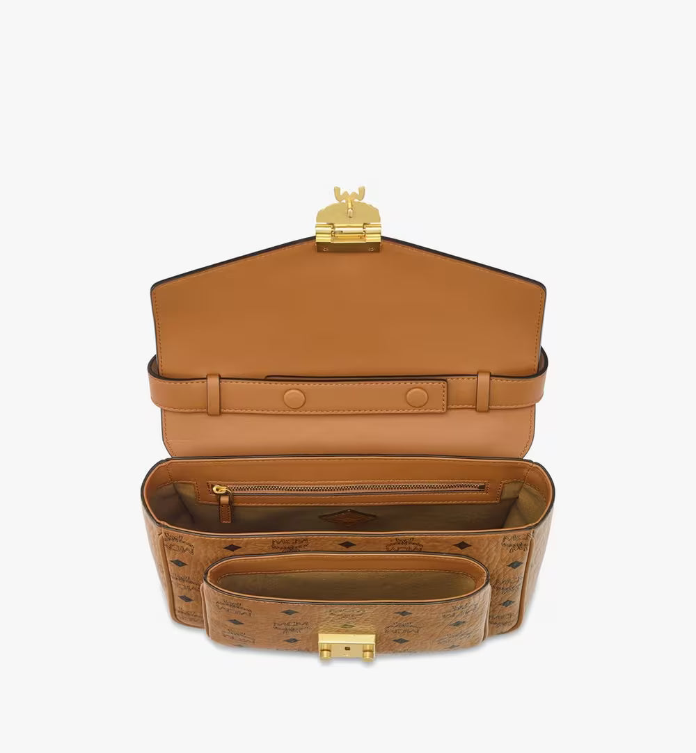 An overhead view of the bag's interior revealing multiple compartments, a zippered pocket, and the front slip pocket.