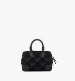 The back view of the Ella bag showing the continuous Lurex monogram pattern and the elegant leather trim.