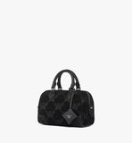 A perspective shot highlighting the structured Boston silhouette and the detachable black leather crossbody strap.
