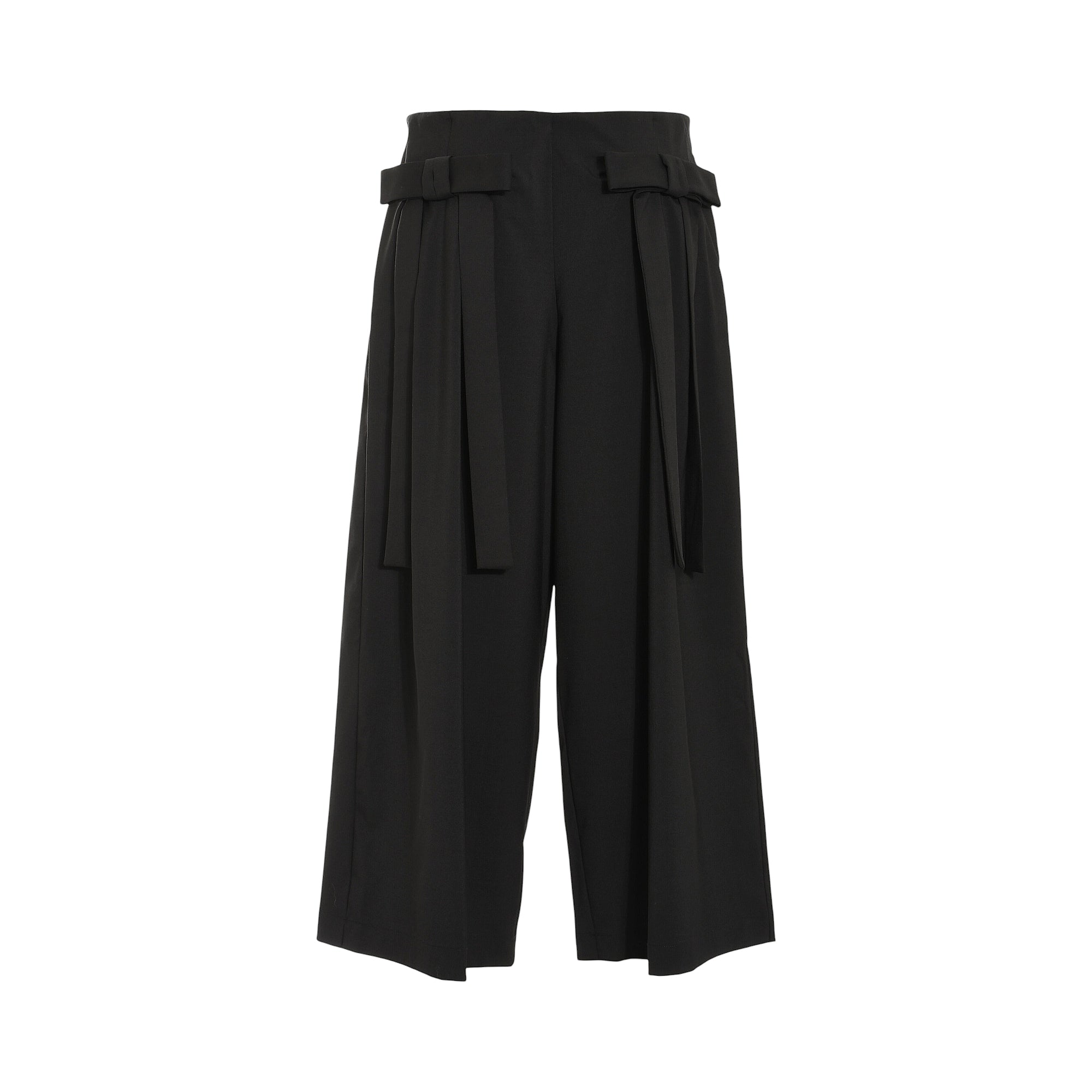 Black high-waisted wide-leg cropped trousers with front pleats and two fabric ties knotted at the waist.