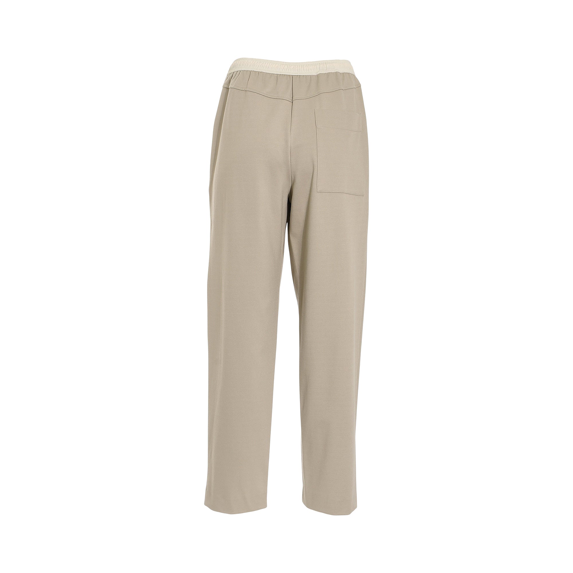 Light almond fabric trousers with an elasticated cream waistband and a single patch pocket on the right rear.