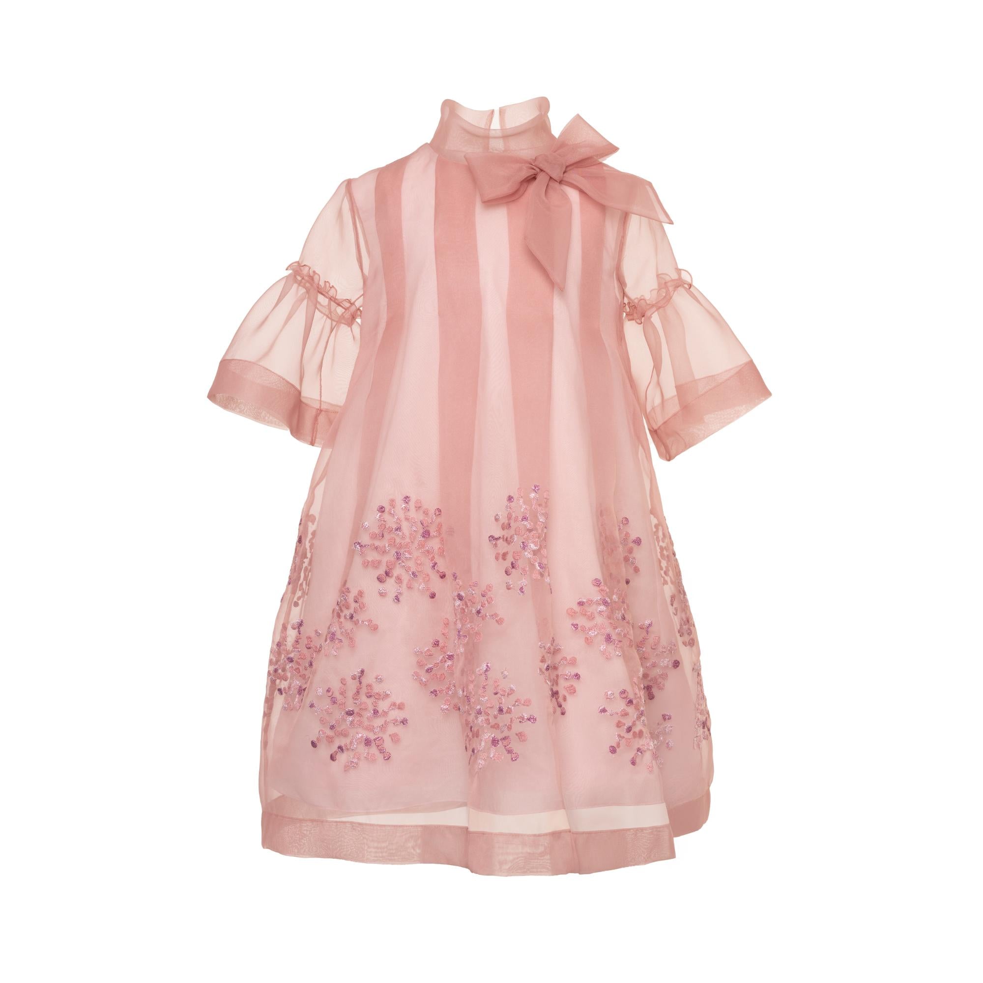 Pink sheer A-line dress with high ruffled collar, matching bow, bell sleeves, and purple floral sequin embellishments on the